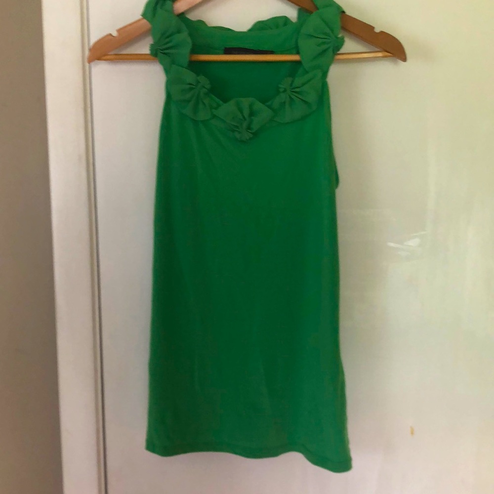 The limited sleeveless blouse. Super flattering fit